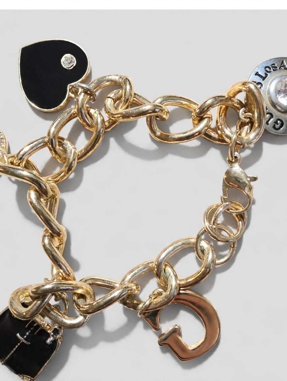 Guess Gold and Black Charm Bracelet